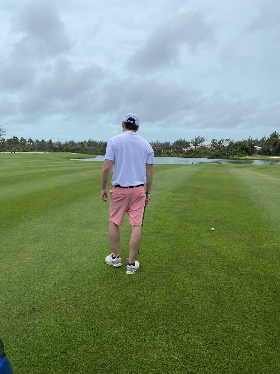 Golfer walking the fairway at Sandals Emerald Bay